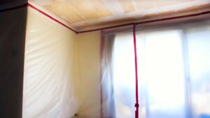 a room where popcorn ceiling removal is underway