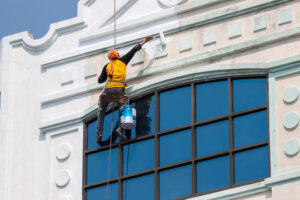 commercial painters painting the outside of a business